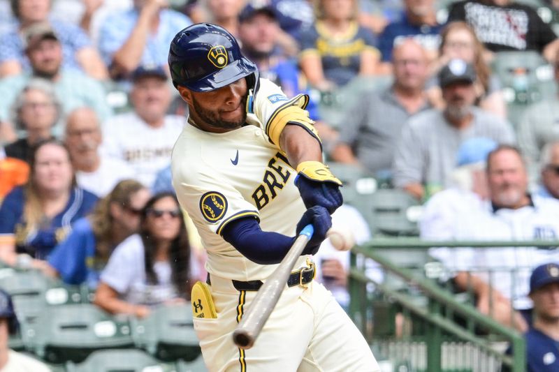 Aug 29, 2024; Milwaukee, Wisconsin, USA; Milwaukee Brewers left fielder Jackson Chourio (11) hits a double to drive in two runs in the fourth inning against the San Francisco Giants at American Family Field. Mandatory Credit: Benny Sieu-USA TODAY Sports