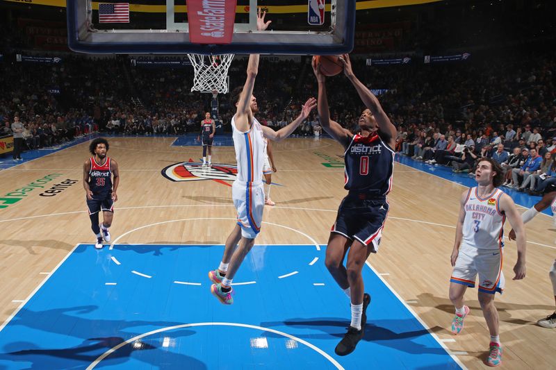 OKLAHOMA CITY, OK - FEBRUARY 23: Bilal Coulibaly #0 of the Washington Wizards drives to the basket during the game against the Oklahoma City Thunder on February 23, 2024 at Paycom Arena in Oklahoma City, Oklahoma. NOTE TO USER: User expressly acknowledges and agrees that, by downloading and or using this photograph, User is consenting to the terms and conditions of the Getty Images License Agreement. Mandatory Copyright Notice: Copyright 2024 NBAE (Photo by Zach Beeker/NBAE via Getty Images)