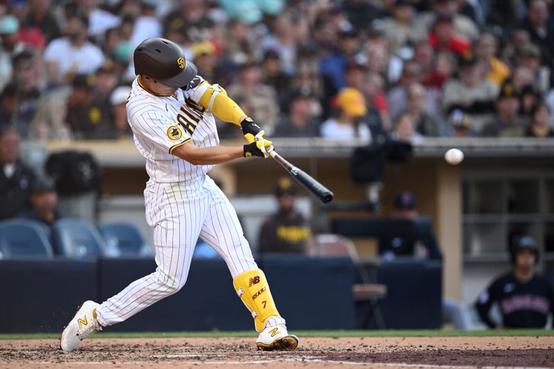 Jun 15, 2023; San Diego, California, USA; San Diego Padres second baseman Ha-seong Kim (7) hits a single against the Cleveland Guardians during the third inning at Petco Park. Mandatory Credit: Orlando Ramirez-USA TODAY Sports