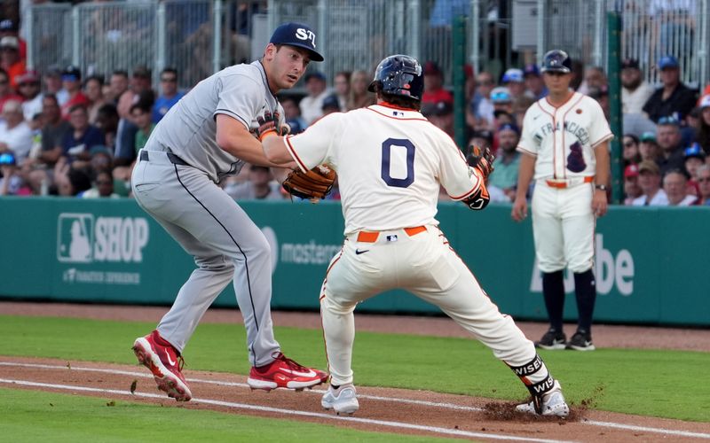 Jun 20, 2024; Fairfield, Alabama, USA; St. Louis Cardinals pitcher Andre Pallante (53) attempts to tag out San Francisco Giants shortstop Brett Wisely (0) during the 1st inning in the MLB at Rickwood Field tribute game to the Negro Leagues. Rickwood Field is the oldest baseball stadium in America. Mandatory Credit: John David Mercer-USA TODAY Sports