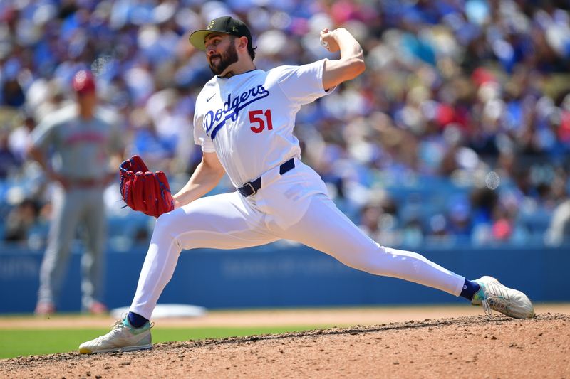 May 19, 2024; Los Angeles, California, USA; Los Angeles Dodgers pitcher Alex Vesia (51) throws against the Cincinnati Reds during the eighth inning  at Dodger Stadium. Mandatory Credit: Gary A. Vasquez-USA TODAY Sports