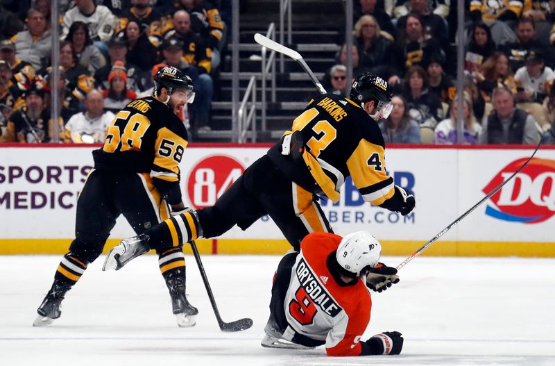 Feb 25, 2024; Pittsburgh, Pennsylvania, USA;  Pittsburgh Penguins center Jansen Harkins (43) checks Philadelphia Flyers defenseman Jamie Drysdale (9) during the second period at PPG Paints Arena. Mandatory Credit: Charles LeClaire-USA TODAY Sports