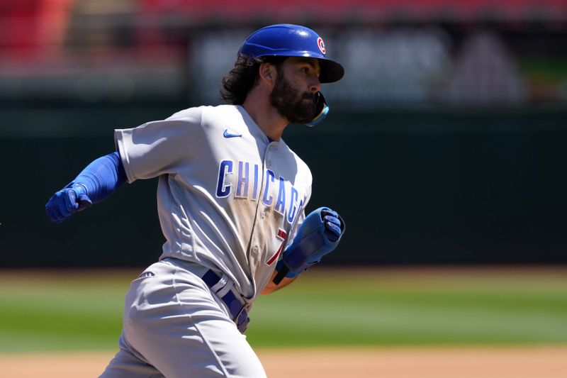 Apr 19, 2023; Oakland, California, USA; Chicago Cubs shortstop Dansby Swanson (7) rounds third base and scores a run against the Oakland Athletics during the fourth inning at Oakland-Alameda County Coliseum. Mandatory Credit: Darren Yamashita-USA TODAY Sports