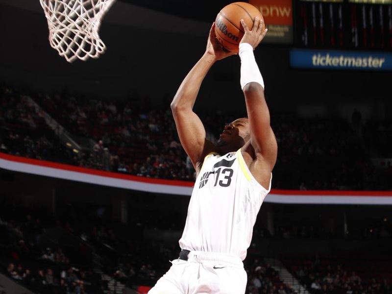 PORTLAND, OR - DECEMBER 6: Isaiah Collier #13 of the Utah Jazz dunks the ball during the game against the Portland Trail Blazers on December 6, 2024 at the Moda Center Arena in Portland, Oregon. NOTE TO USER: User expressly acknowledges and agrees that, by downloading and or using this photograph, user is consenting to the terms and conditions of the Getty Images License Agreement. Mandatory Copyright Notice: Copyright 2024 NBAE (Photo by Cameron Browne/NBAE via Getty Images)