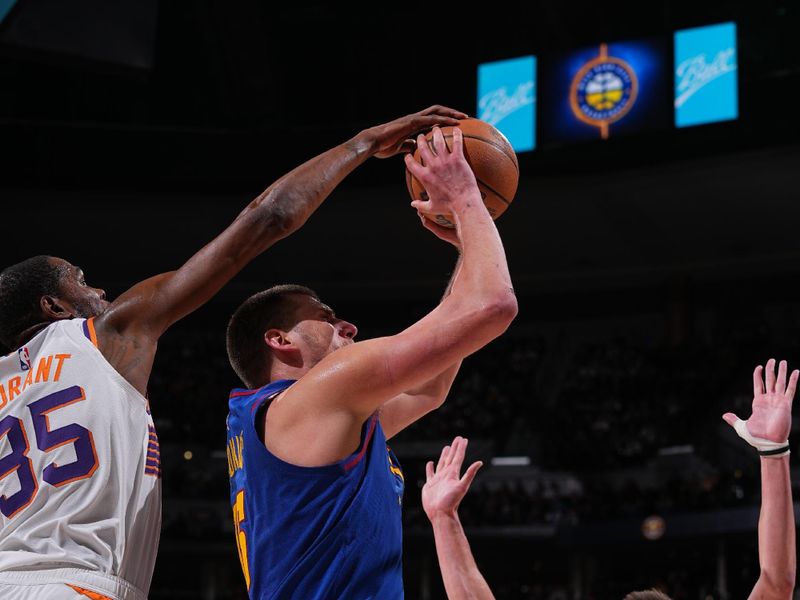 DENVER, CO - MARCH 5: Kevin Durant #35 of the Phoenix Suns blocks the shot by Nikola Jokic #15 of the Denver Nuggets during the game on March 5, 2024 at the Ball Arena in Denver, Colorado. NOTE TO USER: User expressly acknowledges and agrees that, by downloading and/or using this Photograph, user is consenting to the terms and conditions of the Getty Images License Agreement. Mandatory Copyright Notice: Copyright 2024 NBAE (Photo by Bart Young/NBAE via Getty Images)