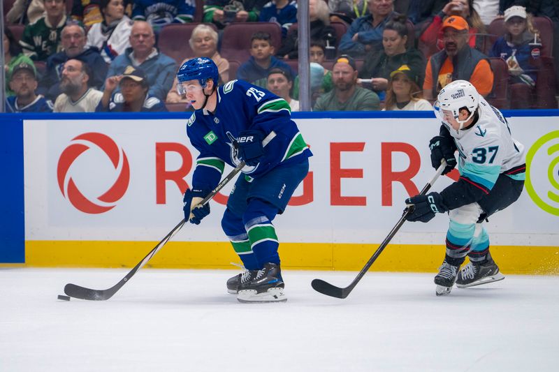 Sep 24, 2024; Vancouver, British Columbia, CAN; Seattle Kraken defenseman Nikolas Brouillard (27) defends against Vancouver Canucks forward Jonathan Lekkerimaki (23) during the first period at Rogers Arena. Mandatory Credit: Bob Frid-Imagn Images