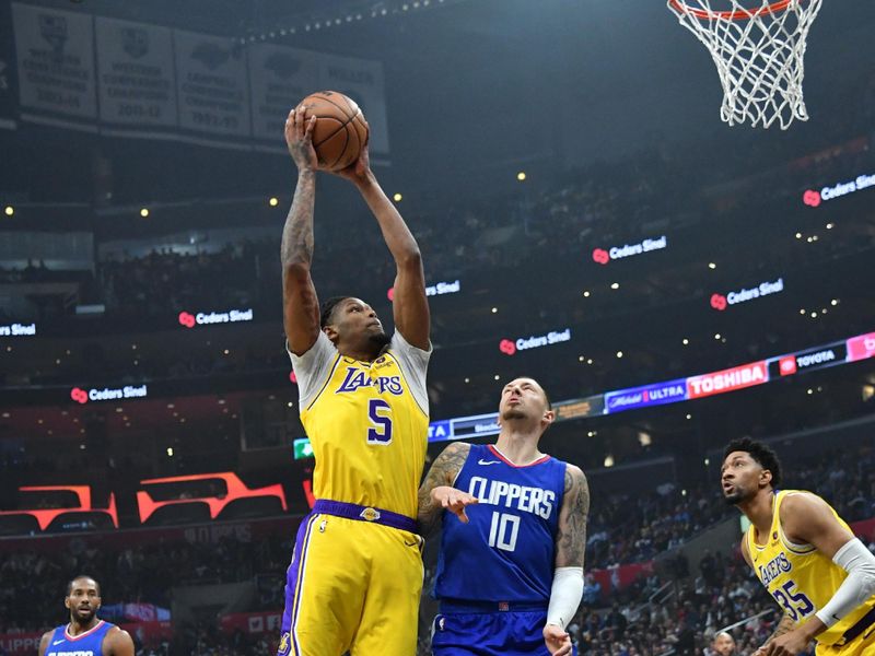 LOS ANGELES, CA - JANUARY 23:  Cam Reddish #5 of the Los Angeles Lakers goes to the basket during the game on January 23, 2024 at Crypto.Com Arena in Los Angeles, California. NOTE TO USER: User expressly acknowledges and agrees that, by downloading and/or using this Photograph, user is consenting to the terms and conditions of the Getty Images License Agreement. Mandatory Copyright Notice: Copyright 2024 NBAE (Photo by Juan Ocampo/NBAE via Getty Images)