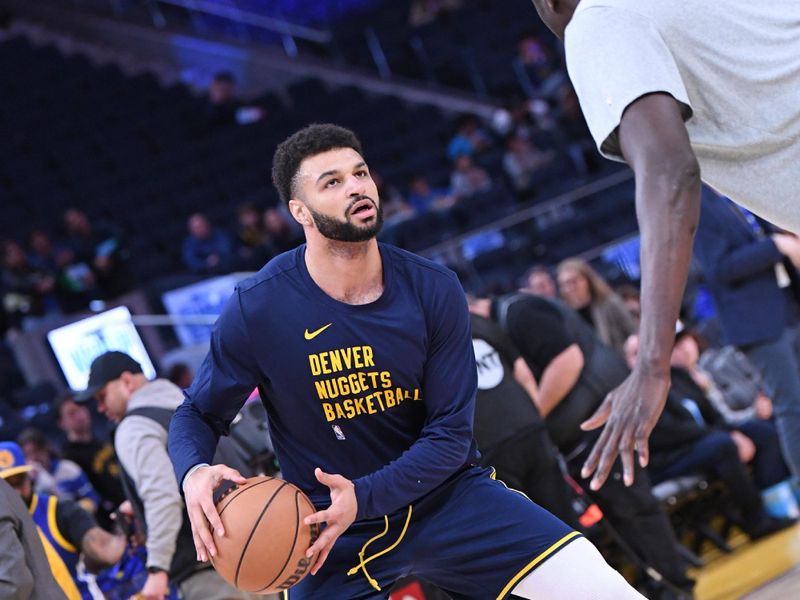 SAN FRANCISCO, CA - JANUARY 4: Jamal Murray #27 of the Denver Nuggets warms up before the game against the Golden State Warriors on January 4, 2024 at Chase Center in San Francisco, California. NOTE TO USER: User expressly acknowledges and agrees that, by downloading and or using this photograph, user is consenting to the terms and conditions of Getty Images License Agreement. Mandatory Copyright Notice: Copyright 2024 NBAE (Photo by Noah Graham/NBAE via Getty Images)