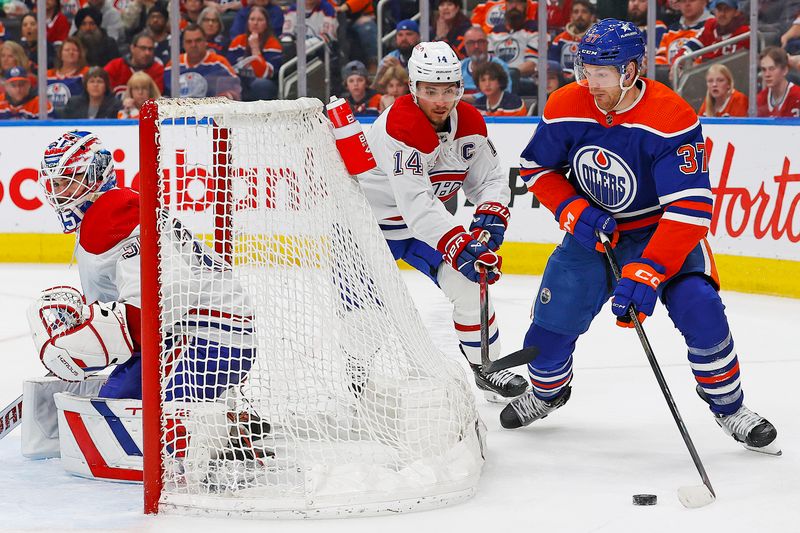 Mar 19, 2024; Edmonton, Alberta, CAN; Edmonton Oilers forward Warren Foegele (37) looks to make a pass from b behind Montreal Canadiens goaltender Sam Montembeault (35) during the third period at Rogers Place. Mandatory Credit: Perry Nelson-USA TODAY Sports