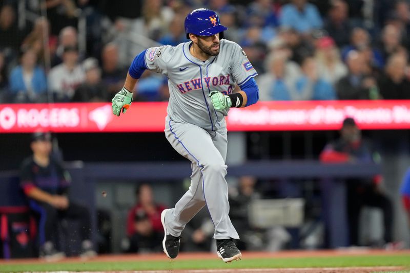 Sep 9, 2024; Toronto, Ontario, CAN; New York Mets designated hitter J.D. Martinez (28) runs to first base on his  one run single against the Toronto Blue Jays during the fourth inning at Rogers Centre. Mandatory Credit: John E. Sokolowski-Imagn Images