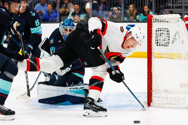 Jan 4, 2024; Seattle, Washington, USA; Ottawa Senators left wing Brady Tkachuk (7) misses the puck on a rebound against Seattle Kraken goaltender Joey Daccord (35) during the first period at Climate Pledge Arena. Mandatory Credit: Joe Nicholson-USA TODAY Sports