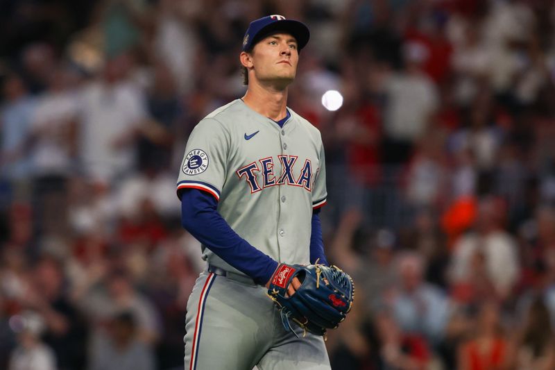 Apr 19, 2024; Atlanta, Georgia, USA; Texas Rangers pitcher Jacob Latz (67) walks off the mound after giving up a grand slam against the Atlanta Braves in the sixth inning at Truist Park. Mandatory Credit: Brett Davis-USA TODAY Sports