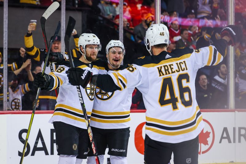 Feb 28, 2023; Calgary, Alberta, CAN; Boston Bruins center Pavel Zacha (18) celebrates his goal with teammates against the Calgary Flames during the third period at Scotiabank Saddledome. Mandatory Credit: Sergei Belski-USA TODAY Sports