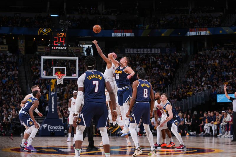 DENVER, CO - MARCH 31: Open tip-off between Jarrett Allen #31 of the Cleveland Cavaliers & Nikola Jokic #15 of the Denver Nuggets on March 31, 2024 at the Ball Arena in Denver, Colorado. NOTE TO USER: User expressly acknowledges and agrees that, by downloading and/or using this Photograph, user is consenting to the terms and conditions of the Getty Images License Agreement. Mandatory Copyright Notice: Copyright 2024 NBAE (Photo by Bart Young/NBAE via Getty Images)