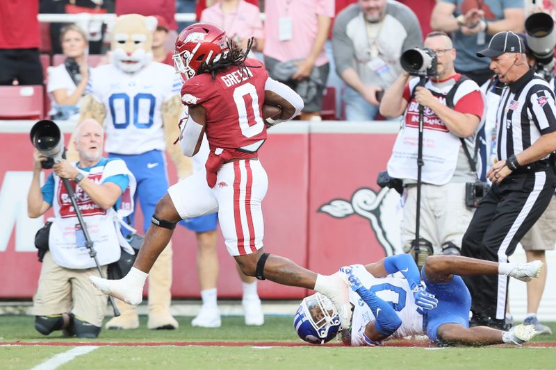 Sep 16, 2023; Fayetteville, Arkansas, USA; Arkansas Razorbacks running back AJ Green (0) rushes for a touchdown in the first quarter against the BYU Cougars at Donald W. Reynolds Razorback Stadium. Mandatory Credit: Nelson Chenault-USA TODAY Sports