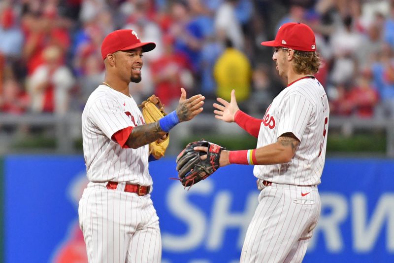 Jul 26, 2023; Philadelphia, Pennsylvania, USA; Philadelphia Phillies third baseman Edmundo Sosa (33) and second baseman Bryson Stott (5) celebrate final out in win against the Baltimore Orioles at Citizens Bank Park. Mandatory Credit: Eric Hartline-USA TODAY Sports