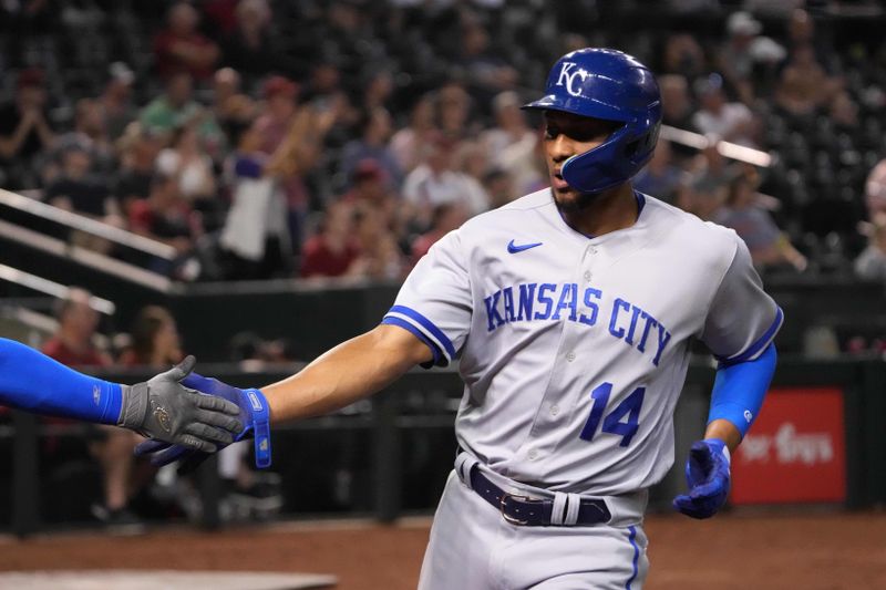 Apr 25, 2023; Phoenix, Arizona, USA; Kansas City Royals left fielder Edward Olivares (14) celebrates after scoring a run against the Arizona Diamondbacks during the fifth inning at Chase Field. Mandatory Credit: Joe Camporeale-USA TODAY Sports