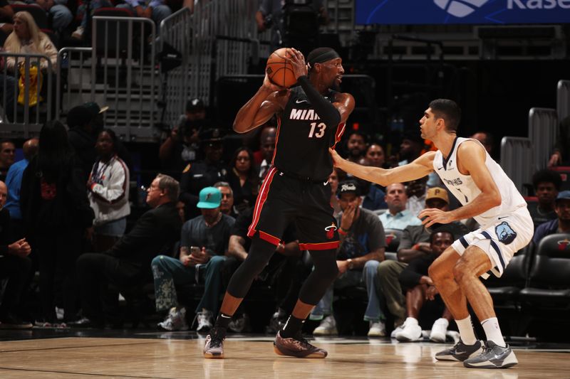 MIAMI, FL - APRIL 3: Bam Adebayo #13 of the Miami Heat looks to pass the ball during the game against the Memphis Grizzlies on April 3, 2025 at Kaseya Center in Miami, Florida. NOTE TO USER: User expressly acknowledges and agrees that, by downloading and or using this Photograph, user is consenting to the terms and conditions of the Getty Images License Agreement. Mandatory Copyright Notice: Copyright 2025 NBAE (Photo by Issac Baldizon/NBAE via Getty Images)