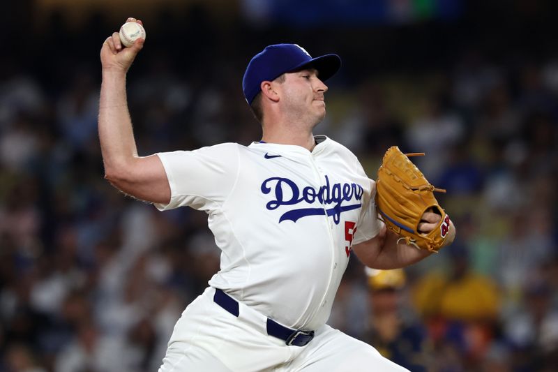 Jul 5, 2024; Los Angeles, California, USA;  Los Angeles Dodgers relief pitcher Evan Phillips (59) pitches during the ninth inning against the Milwaukee Brewers at Dodger Stadium. Mandatory Credit: Kiyoshi Mio-USA TODAY Sports