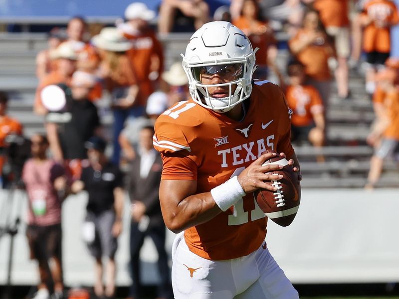 Oct 9, 2021; Dallas, Texas, USA; Texas Longhorns quarterback Casey Thompson (11) warms up before the game against the Oklahoma Sooners at the Cotton Bowl. Mandatory Credit: Kevin Jairaj-USA TODAY Sports