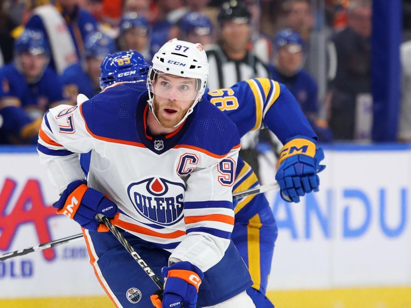 Mar 9, 2024; Buffalo, New York, USA;  Edmonton Oilers center Connor McDavid (97) looks to make a pass during the first period against the Buffalo Sabres at KeyBank Center. Mandatory Credit: Timothy T. Ludwig-USA TODAY Sports