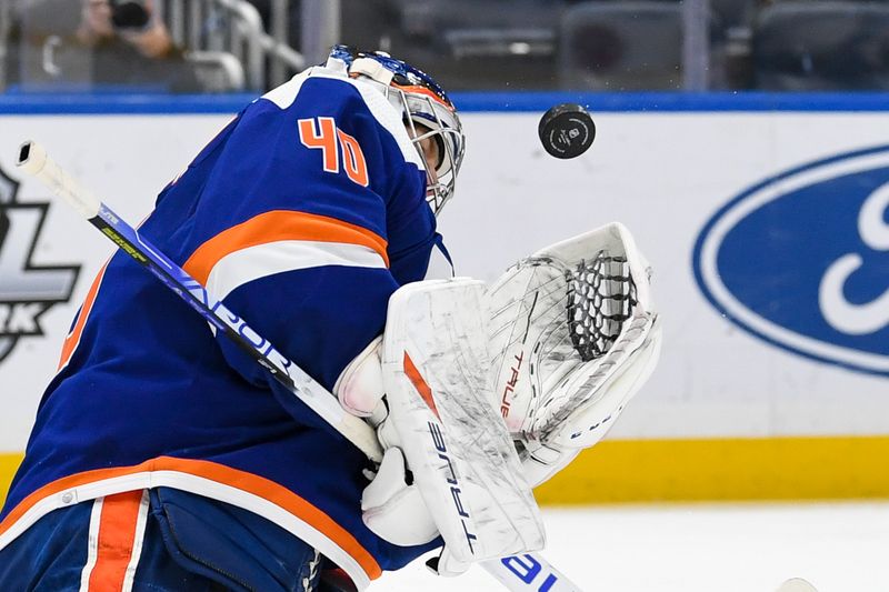 Oct 18, 2022; Elmont, New York, USA; New York Islanders goaltender Semyon Varlamov (40) makes a save against the San Jose Sharks during the third period at UBS Arena. Mandatory Credit: Dennis Schneidler-USA TODAY Sports