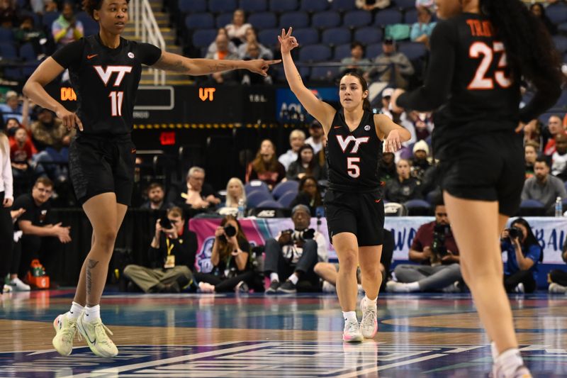 Mar 4, 2023; Greensboro, NC, USA; Virginia Tech Hokies guard Georgia Amoore (5) celebrates after a three point basket against the Duke Blue Devils during the first half at Greensboro Coliseum. Mandatory Credit: William Howard-USA TODAY Sports