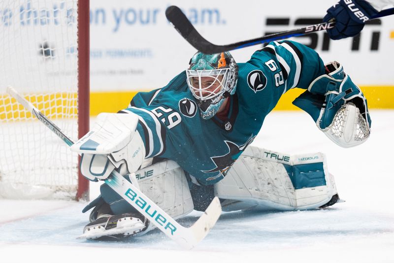 Nov 14, 2023; San Jose, California, USA; San Jose Sharks goaltender Mackenzie Blackwood (29) reaches out to defend the goal during the third period against the Florida Panthers at SAP Center at San Jose. Mandatory Credit: Stan Szeto-USA TODAY Sports