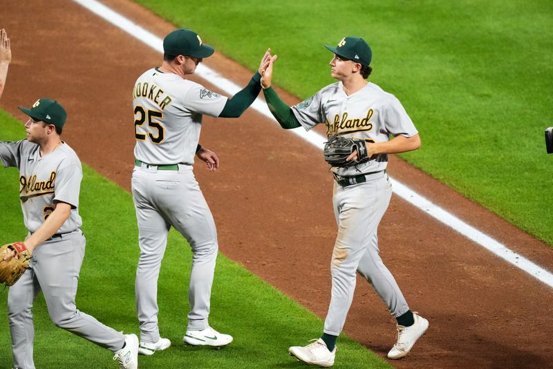 Jul 29, 2023; Denver, Colorado, USA; Oakland Athletics second baseman Zack Gelof (20) and left fielder Brent Rooker (25) celebrate after defeating the Colorado Rockies at Coors Field. Mandatory Credit: Ron Chenoy-USA TODAY Sports