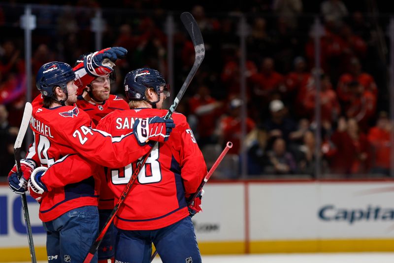 Mar 3, 2025; Washington, District of Columbia, USA; Washington Capitals left wing Pierre-Luc Dubois (80) celebrates with teammates after scoring a goal against the Ottawa Senators in the first period at Capital One Arena. Mandatory Credit: Geoff Burke-Imagn Images