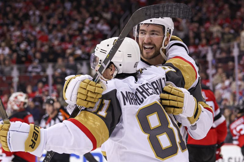 Jan 22, 2024; Newark, New Jersey, USA; Vegas Golden Knights center Nicolas Roy (10) celebrates his goal against the New Jersey Devils during the second period with right wing Jonathan Marchessault (81) at Prudential Center. Mandatory Credit: Vincent Carchietta-USA TODAY Sports