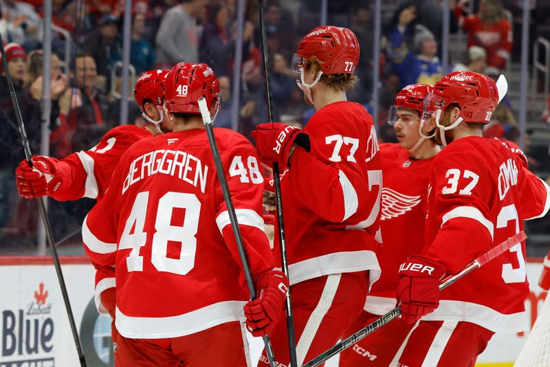 Jan 14, 2025; Detroit, Michigan, USA;  Detroit Red Wings right wing Vladimir Tarasenko (11) celebrates with teammates after scoring in the second period against the San Jose Sharksat Little Caesars Arena. Mandatory Credit: Rick Osentoski-Imagn Images