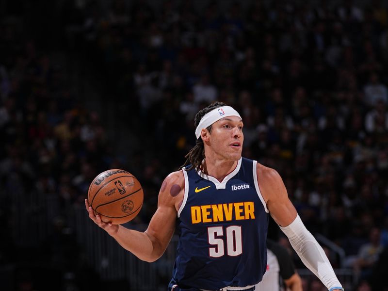 DENVER, CO - APRIL 10: Aaron Gordon #50 of the Denver Nuggets handles the ball during the game against the Minnesota Timberwolves on April 10, 2024 at the Ball Arena in Denver, Colorado. NOTE TO USER: User expressly acknowledges and agrees that, by downloading and/or using this Photograph, user is consenting to the terms and conditions of the Getty Images License Agreement. Mandatory Copyright Notice: Copyright 2024 NBAE (Photo by Bart Young/NBAE via Getty Images)