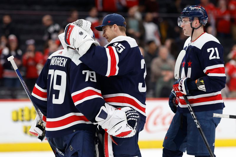 Feb 20, 2024; Washington, District of Columbia, USA; Washington Capitals goaltender Charlie Lindgren (79) celebrates with Capitals goaltender Darcy Kuemper (35) after their game against the New Jersey Devils at Capital One Arena. Mandatory Credit: Geoff Burke-USA TODAY Sports