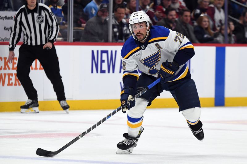 Jan 31, 2025; Denver, Colorado, USA; St. Louis Blues defenseman Justin Faulk (72) skates with the puck during the first period against the Colorado Avalanche at Ball Arena. Mandatory Credit: Christopher Hanewinckel-Imagn Images