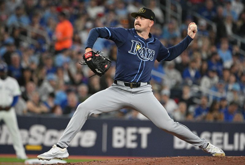 May 17, 2024; Toronto, Ontario, CAN;  Tampa Bay Rays starting pitcher Tyler Alexander (14) delivers a pitch against the Toronto Blue Jays in the first inning at Rogers Centre. Mandatory Credit: Dan Hamilton-USA TODAY Sports