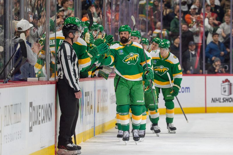 Dec 11, 2025; Saint Paul, Minnesota, USA; Minnesota Wild defenseman Zach Bogosian (24) is congratulated by the bench after scoring on the Dallas Stars in the second period at Grand Casino Arena. Mandatory Credit: Matt Blewett-Imagn Images