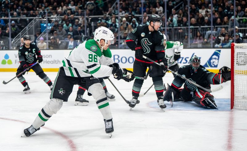 Nov 26, 2025; Seattle, Washington, USA; Dallas Stars forward Mikko Rantanen (96) takes a shot against Seattle Kraken goalie Joey Daccord (35), right, during the first period at Climate Pledge Arena. Mandatory Credit: Stephen Brashear-Imagn Images