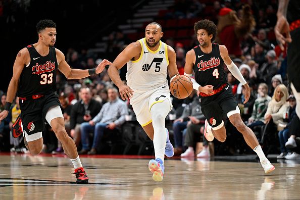 PORTLAND, OREGON - DECEMBER 14: Talen Horton-Tucker #5 of the Utah Jazz dribbles during the first quarter of the game against the Portland Trail Blazers at Moda Center on December 14, 2023 in Portland, Oregon. NOTE TO USER: User expressly acknowledges and agrees that, by downloading and or using this Photograph, user is consenting to the terms and conditions of the Getty Images License Agreement. (Photo by Alika Jenner/Getty Images)