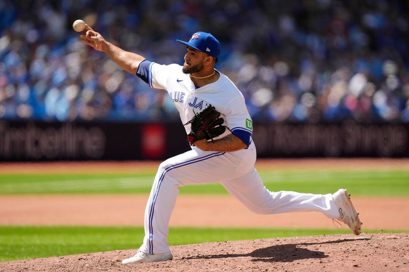 Jul 30, 2023; Toronto, Ontario, CAN; Toronto Blue Jays pitcher Yimi Garcia (93) pitches to the Los Angeles Angels during the tenth inning at Rogers Centre. Mandatory Credit: John E. Sokolowski-USA TODAY Sports