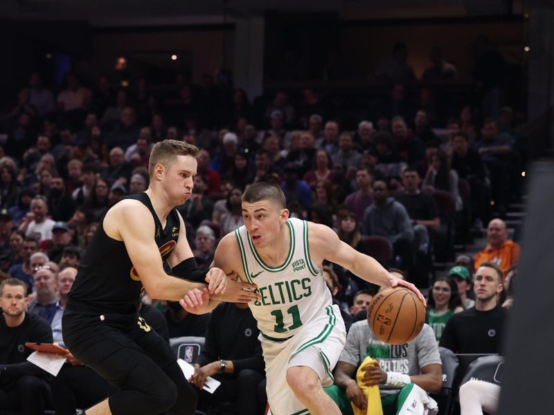 CLEVELAND, OH - MARCH 5: Payton Pritchard #11 of the Boston Celtics dribbles the ball during the game against the Cleveland Cavaliers on March 5, 2024 at Rocket Mortgage FieldHouse in Cleveland, Ohio. NOTE TO USER: User expressly acknowledges and agrees that, by downloading and/or using this Photograph, user is consenting to the terms and conditions of the Getty Images License Agreement. Mandatory Copyright Notice: Copyright 2024 NBAE (Photo by Lauren Leigh Bacho<p><br/></p>/NBAE via Getty Images)