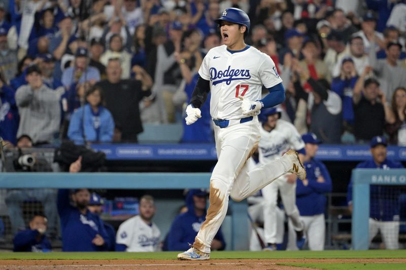 Sep 26, 2024; Los Angeles, California, USA;Los Angeles Dodgers designated hitter Shohei Ohtani (17) scores on a RBI single by shortstop Mookie Betts (50) in the seventh inning against the San Diego Padres at Dodger Stadium. Mandatory Credit: Jayne Kamin-Oncea-Imagn Images