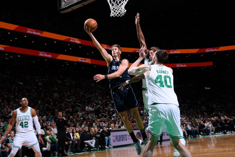 BOSTON, MA - APRIL 20: Franz Wagner #22 of the Orlando Magic drives to the basket during the game against the Boston Celtics during Round 1 Game 1 of the 2025 NBA Playoffs on April 20, 2025 at TD Garden in Boston, Massachusetts. NOTE TO USER: User expressly acknowledges and agrees that, by downloading and/or using this Photograph, user is consenting to the terms and conditions of the Getty Images License Agreement. Mandatory Copyright Notice: Copyright 2025 NBAE (Photo by Brian Babineau/NBAE via Getty Images)