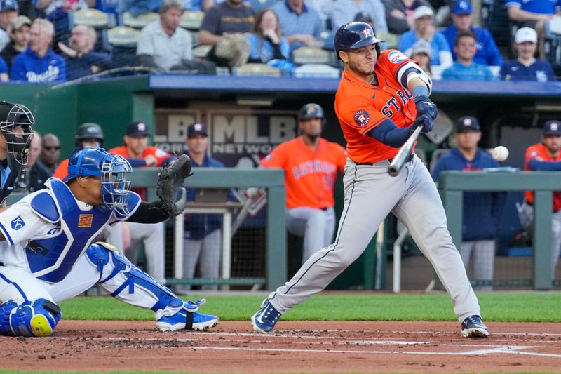 Apr 9, 2024; Kansas City, Missouri, USA; Houston Astros designated hitter Kyle Tucker (30) hits a one run force out against the Kansas City Royals in the first inning at Kauffman Stadium. Mandatory Credit: Denny Medley-USA TODAY Sports
