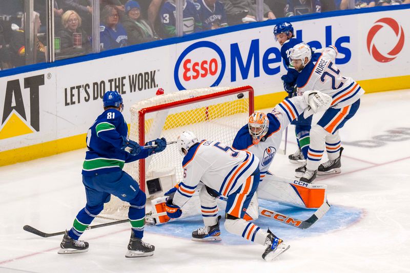 May 8, 2024; Vancouver, British Columbia, CAN; Vancouver Canucks forward Elias Lindholm (23) and Edmonton Oilers defenseman Cody Ceci (5) and goalie Stuart Skinner (74) and defenseman Darnell Nurse (25) watch as Vancouver Canucks forward Dakota Joshua (81) scores on Skinner during the second period in game one of the first round of the 2024 Stanley Cup Playoffs at Rogers Arena. Mandatory Credit: Bob Frid-USA TODAY Sports