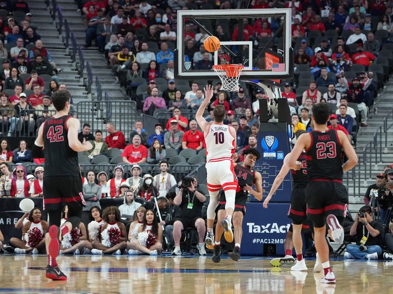 Mar 9, 2023; Las Vegas, NV, USA; Arizona Wildcats forward Azuolas Tubelis (10) shoots against Stanford Cardinal forward Spencer Jones (14) during the first half at T-Mobile Arena. Mandatory Credit: Stephen R. Sylvanie-USA TODAY Sports