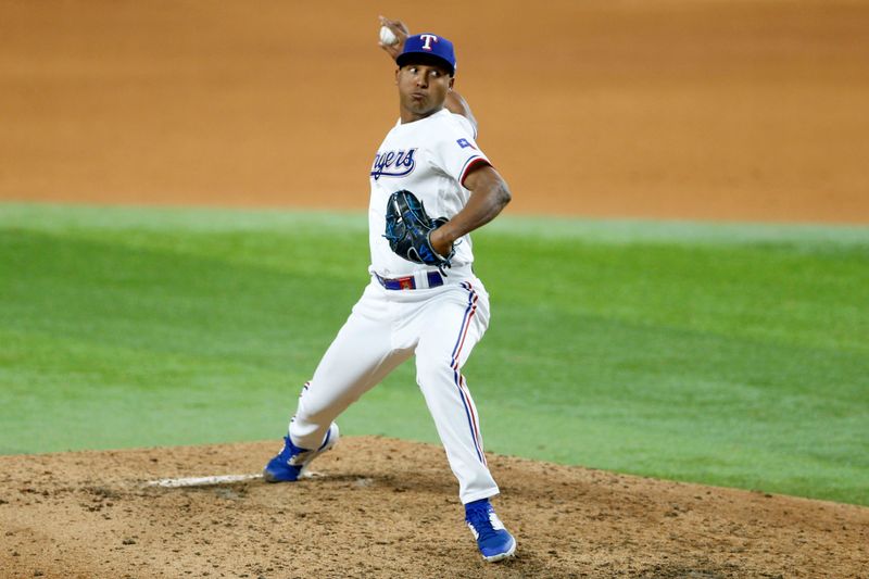 Oct 10, 2023; Arlington, Texas, USA; Texas Rangers relief pitcher Aroldis Chapman (45) pitches in the eighth inning against the Baltimore Orioles during game three of the ALDS for the 2023 MLB playoffs at Globe Life Field. Mandatory Credit: Andrew Dieb-USA TODAY Sports