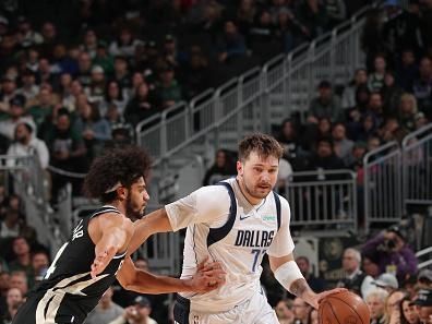 MILWAUKEE, WI - NOVEMBER 18: Luka Doncic #77 of the Dallas Mavericks dribbles the ball during the game against the Milwaukee Bucks on November 18, 2023 at the Fiserv Forum Center in Milwaukee, Wisconsin. NOTE TO USER: User expressly acknowledges and agrees that, by downloading and or using this Photograph, user is consenting to the terms and conditions of the Getty Images License Agreement. Mandatory Copyright Notice: Copyright 2023 NBAE (Photo by Gary Dineen/NBAE via Getty Images).