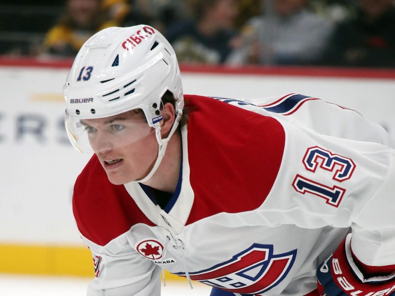 Nov 2, 2024; Pittsburgh, Pennsylvania, USA;  Montreal Canadiens right wing Cole Caufield (13) at the face-off circle against the Pittsburgh Penguins during the third period at PPG Paints Arena. Mandatory Credit: Charles LeClaire-Imagn Images