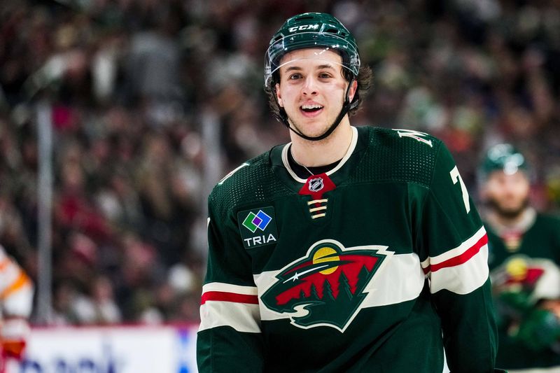 Jan 2, 2024; Saint Paul, Minnesota, USA; Minnesota Wild defenseman Brock Faber (7) looks on during the third period against the Calgary Flames at Xcel Energy Center. Mandatory Credit: Brace Hemmelgarn-USA TODAY Sports